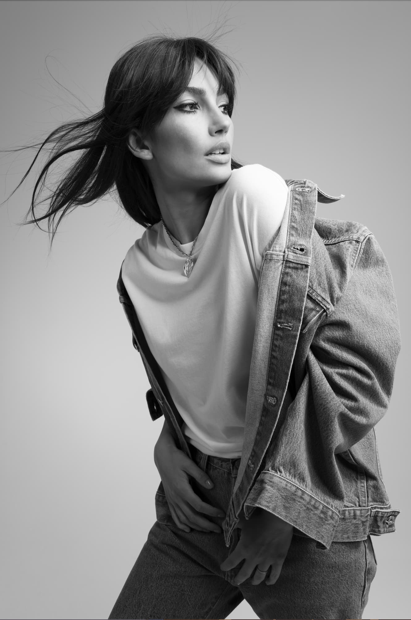 LMC campaign — black and white portrait, wind in her hair