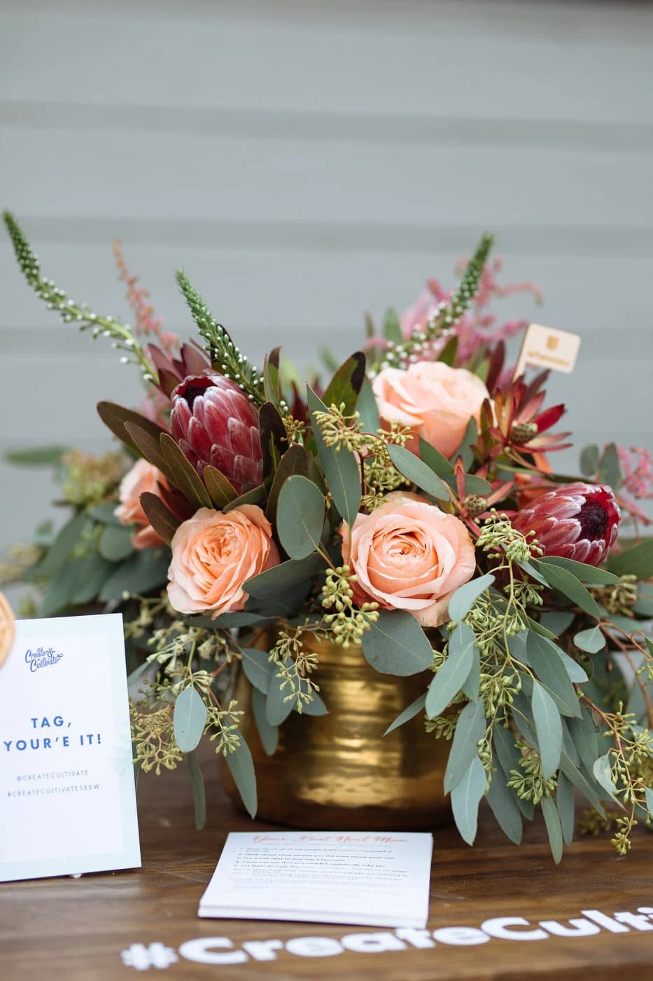 SXSW activation — attendee photo moment with tropical florals