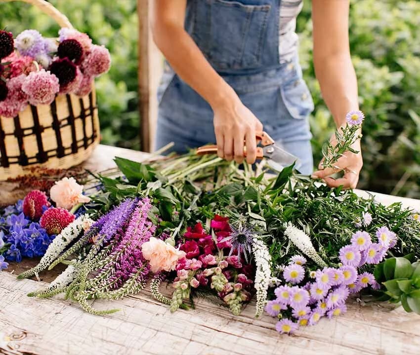 Lifestyle shoot — artisan arranging a seasonal bouquet