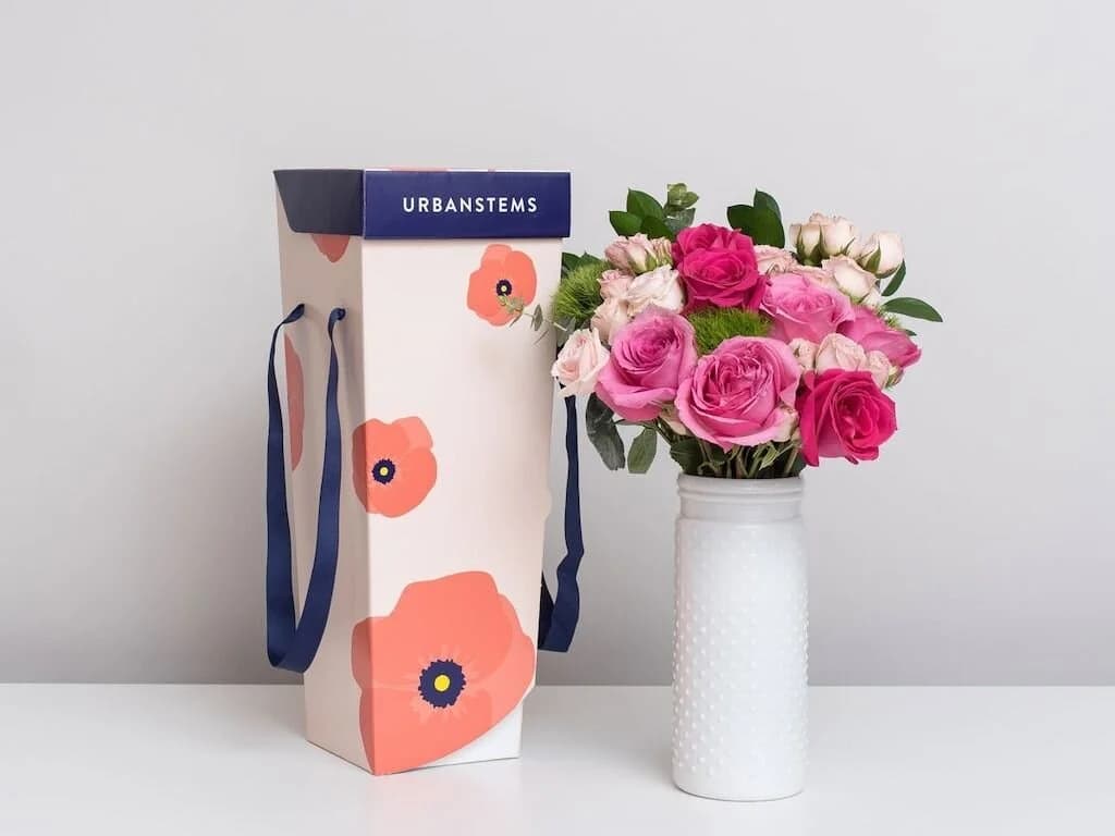 Final UrbanStems courier tote alongside a fresh bouquet
